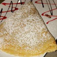 Crepe · Stuffed with nutella topped with strawberry and banana.