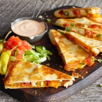 Chicken Quesadilla · Blackened chicken, cheddar cheese, tomatoes, and scallions in a flour tortilla. Served with ...