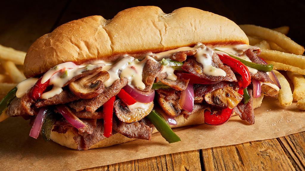Philly Cheesesteak Hoagie · Tender, shaved beef grilled with peppers, onions, and mushrooms all topped with cheddar cheese.