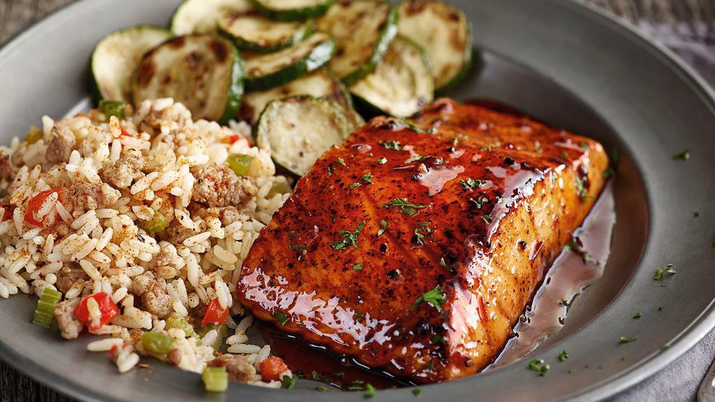 Hickory Bourbon Salmon · A grilled salmon fillet glazed with bourbon BBQ. Served with your choice of two sides.