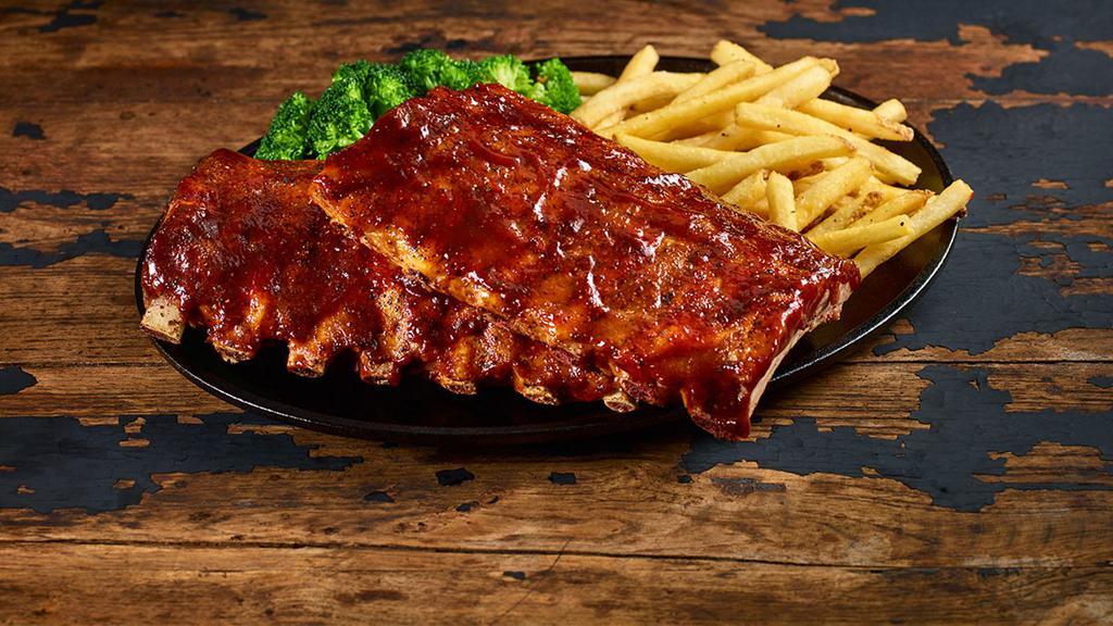 Ribs · Slow-cooked for hours until they fall off the bone. Choose Classic Barbecue, Hickory Bourbon, Nashville Hot, or Texas Dusted dry rub. Served with your choice of two sides.