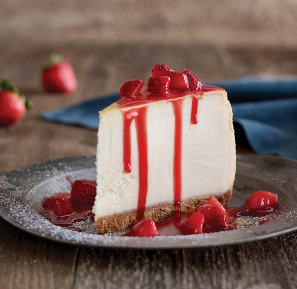 New York Cheesecake · Thick, rich, and creamy. Topped with a generous blanket of juicy strawberries.