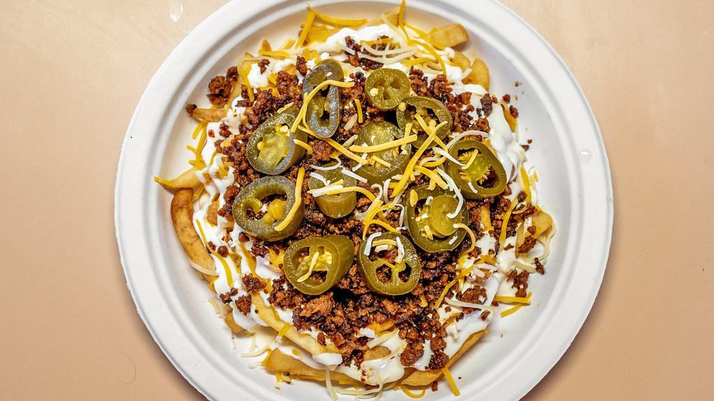 Mexican Fries · Chorizo, sour cream, shredded cheese, and jalapeños.