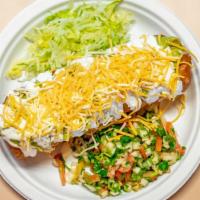Chimichanga · Ground beef or chicken, deep fried, guacamole, sour cream, lettuce, beans and pico de gallo.