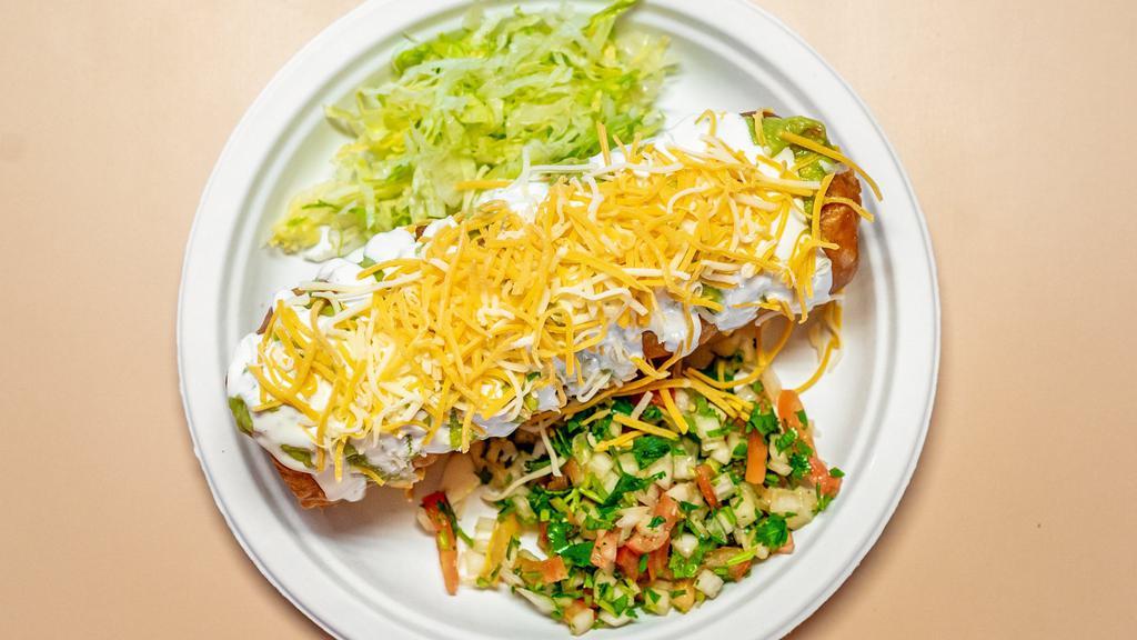 Chimichanga · Ground beef or chicken, deep fried, guacamole, sour cream, lettuce, beans and pico de gallo.