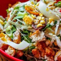 Popcorn Chicken Cobb Salad · Romaine, arugula, & cabbage, tomatoes, pickles,
corn. scallions, dill, egg, housemade biscui...