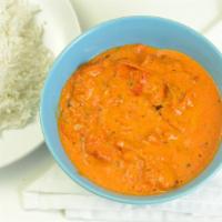 Butter Chicken · Grilled chicken strips cooked in mild creamy curry sauce.