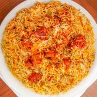 Boneless Chicken Dum Biryani · Boneless chicken with spices and tomatoes, layered in basmati rice and exotic spices.