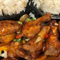 Canh Ga (10) · House marinated chicken wings served with steamed rice