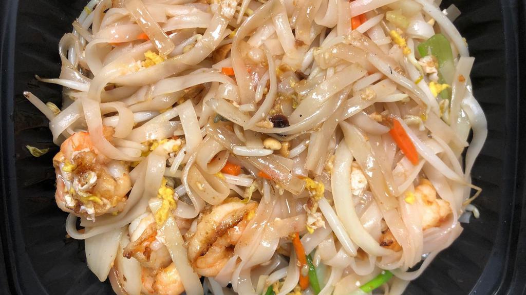 Pad Thai · Thai rice noodle stir fried with fish sauce, egg, bean sprouts, green & white onions, carrots, crushed peanuts, lime