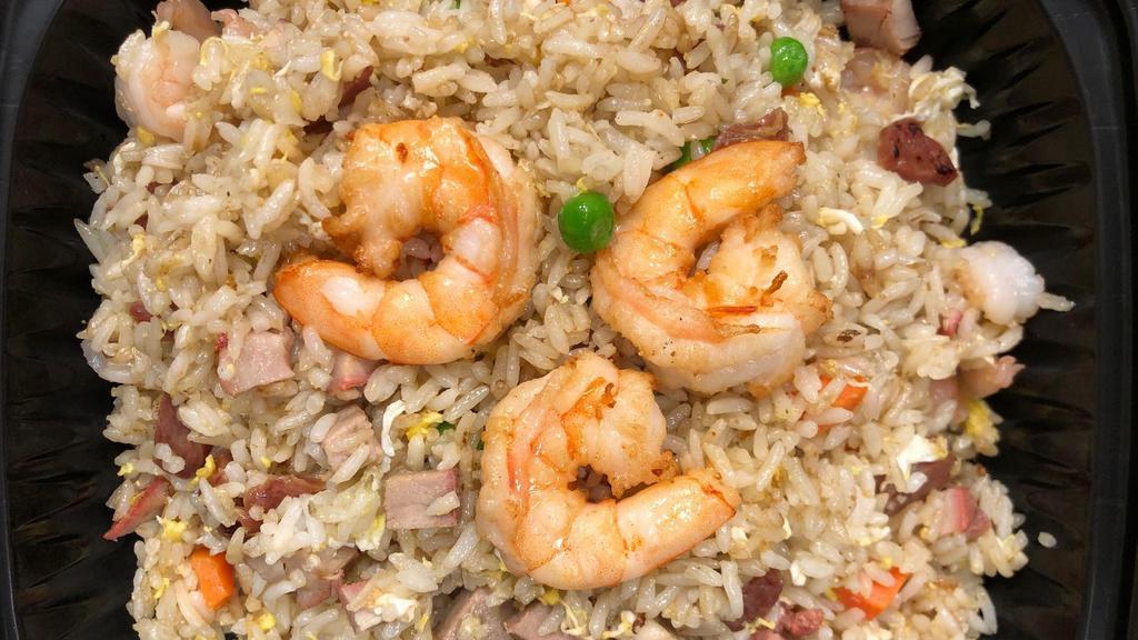 Com Chien Duong Chau · Special assorted combination fried rice with shrimp, smoked BBQ pork, sweet susage, egg, peas, carrots