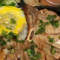 *C10. Com Trung Suon Cha · Grilled pork chop (born-in), meat loaf, over easy egg, steamed rice, side salad