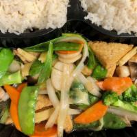 Com Xao Chay · Tofu, assorted veggies, green & white onions stir fry, served with steamed rice