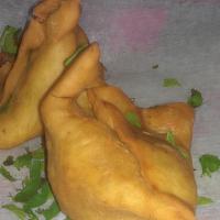 2 Piece Samosas · Fried wheat flour pastries stuffed with fresh seasoned potatoes and green peas.