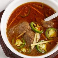 Nihari · Tender beef shanks slow cooked in a mixture of spices served with a thick gravy and garnishe...