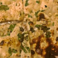 Naan With Toppings · Most popular. Choice of garlic, onion, sesame seed or kalongi.