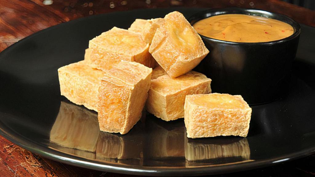 Fried Organic Tofu · served with peanut sauce