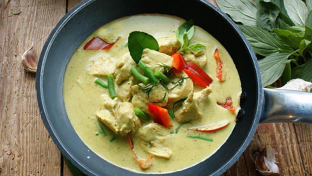 Spicy Green Curry · Spicy green curry (4/5 heat scale) with bamboo shoots, pea pods, bell pepper strips, and fresh Thai basil.  This curry cannot be made mild.