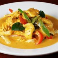 Panang Curry · Medium spiced red coconut curry with fresh pineapple, bell peppers, and Thai basil.
