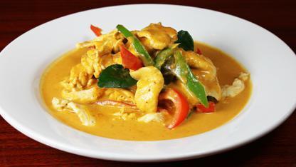 Panang Curry · Medium spiced red coconut curry with fresh pineapple, bell peppers, and Thai basil.