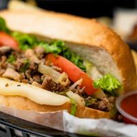 Philly Steak With Fries · Comes With Onion, Mushrooms, Green Peppers, Mayo, Mozzarella Cheese, Lettuce and Tomatoes