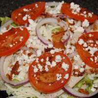 Classic Chicken Salad · A bed of crisp lettuce with seasoned grilled chicken, bacon, mozzarella, red onion, Roma tom...