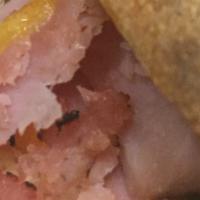 Hot Ham & Cheese · A generous helping of ham and mozzarella with a dash of pizza sauce on a sesame-seed bun. Se...