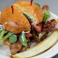 The Brasserie Burger · Half pound ground beef patty, bacon, caramelized onions, Swiss cheese, tomato, watercress, D...