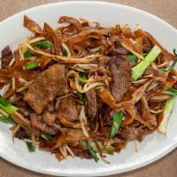 Beef Chow Fun · Beef, onions, bean sprouts, and green onions.