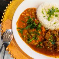 Lamb Curry · Served with basmati rice with the option to add vegetables and Indian bread.
