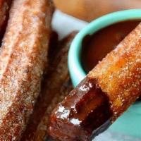 Churro (1) · Each churro is filled with choice of filling, topped with cinnamon sugar and side of ice cre...