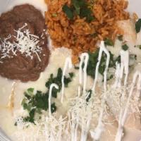 Cheese Enchiladas · Topped with a cheese sauce, cilantro. fresco cheese and sour cream. Side of rice and beans.