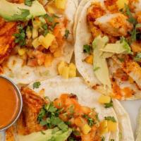 3 Mexican Style Fish Tacos · Tilapia fish sautéed with Guajillo peppers (not spicy) in a corn tortilla with avocado slice...