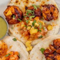 3 Mexican Style Shrimp Tacos · Shrimp sautéed with guajillo peppers (not spicy) in a corn tortilla with avocado slices, Pic...