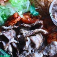 Carne Azada Y Camarones · Smoked Tender steak and shrimp sautéed in guajillo peppers with a side of lettuce, Pico de G...