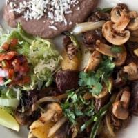 Grilled Steak & Potatoes · Tender steak with sautéed onions, mushrooms, potatoes, sliced jalapenos, rice, beans and cho...