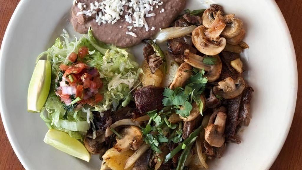 Grilled Steak & Potatoes · Tender steak with sautéed onions, mushrooms, potatoes, sliced jalapenos, rice, beans and choice of corn or flour tortilla.