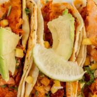 3 Salmon Tacos · Salmon sautéed with guajillo peppers (not spicy) in a corn tortilla with avocado slices, cil...