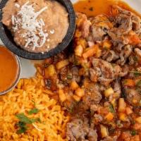 Bistec A La Mexicana · Tender steak topped with a Mexican tomato sauce. Side of lettuce, Pico de Gallo, rice, beans...