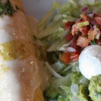 Chimichanga · Filled with rice, beans, mozzarella, choice of meat and topped with our creamy Monterrey-Que...