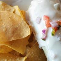 Burrito · Filled with rice, beans, mozzarella, Pico de Gallo and topped with our creamy Monterrey-Ques...