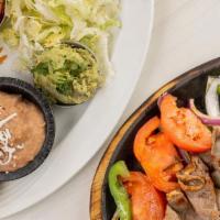 Rosemary Steak Fajitas · Sautéed Bell peppers, onions and tomatoes on a hot skillet. Served with lettuce, Pico de Gal...