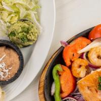 Seafood Combo Fajitas · Sautéed Bell peppers, onions and tomatoes on a hot skillet. Served with lettuce, Pico de Gal...