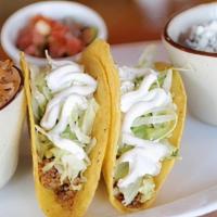 Kids Hard-Shell Tacos (2) · Ground beef, lettuce, sour cream and cheese. Includes side and fountain Coke product.