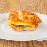 Croissant Breakfast Sandwich · Your Choice of Bacon, Sausage, or Ham with Egg and Cheese OR Meatless