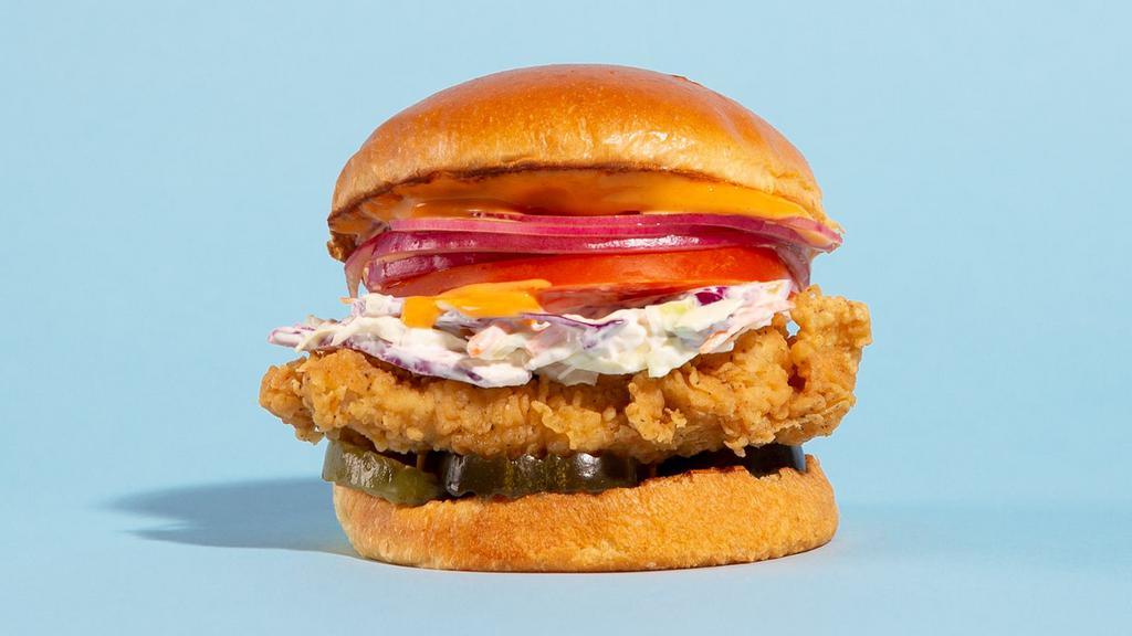 The Fried Chicken Sandwich · Buttermilk fried and served on a brioche bun with slaw, tomatoes, pickles, onions, and a chipotle mayo. Served with fries.