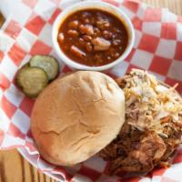 Carolina Pulled Pork · Smoked pork shoulder topped with spicy coleslaw, bubba’s Carolina sauce, toasted bun.