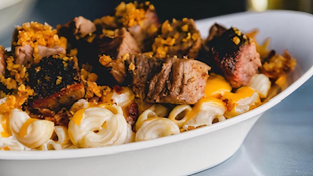 Loaded Mac N Cheese Entree · pasta, queso, shredded cheddar, diced bacon and burnt ends.