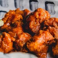Boneless Buffalo Wings · Seasoned flour dusted chicken breast nuggets tossed in our buffalo sauce.  Served with celery