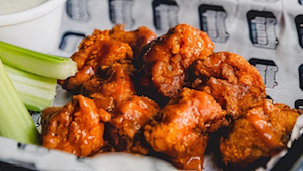 Boneless Buffalo Wings · Seasoned flour dusted chicken breast nuggets tossed in our buffalo sauce.  Served with celery